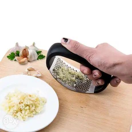 هراس ثوم ضغط طاوله مسكة اسود